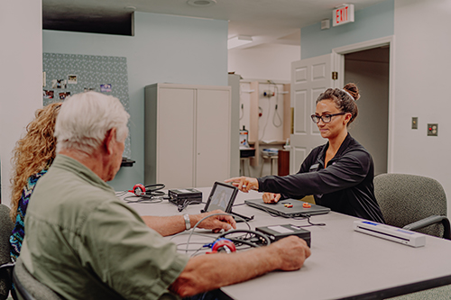 Technician providing hearing conservation training