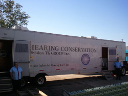 Hearing technicians at mobile unit doors