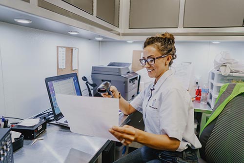 Hearing technician working at computer