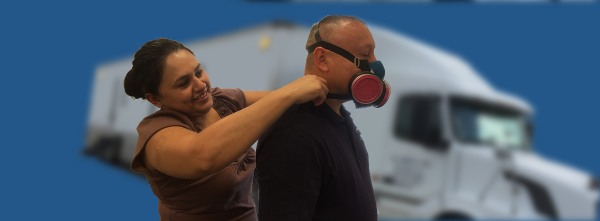 Technician assisting man with respirator test