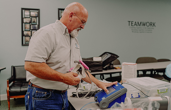 Technician preparing spirometer for PFT