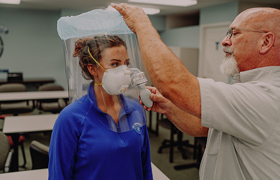 Woman taking pulmonary function test