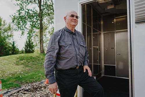 Male technician outside mobile unit